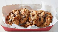 chocolate chip cookies with pecans in a red basket