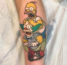 a man with a simpsons tattoo on his leg