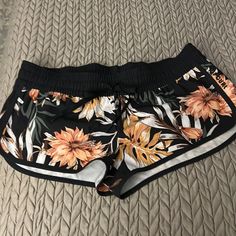 Rip Curl Swim Shorts. Perfect For The Water Or Not. 8.5 Inches From Low Rise Hip To Hem. Excellent Condition. New Without Tags. Size Small Stretch Floral Print Shorts For Beach, Stretch Floral Print Beach Shorts, Beach Floral Print Stretch Shorts, Black Tropical Style Shorts For Vacation, Orange Short Swimwear For Vacation, Casual Black Swimwear With Floral Print, Black Tropical Bottoms For Summer, Tropical Black Shorts For Summer, Black Tropical Shorts For Summer