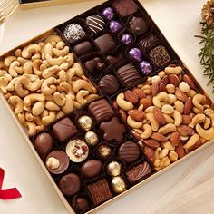 a box filled with assorted chocolates and nuts