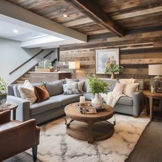 a living room filled with furniture and wooden walls