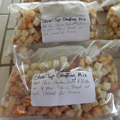 three bags filled with food sitting on top of a tiled counter next to each other