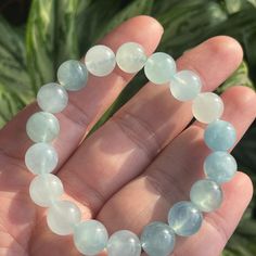 DETAILS: Size: 10mm round beads (19 beads) approx  Weight: 27.2g  Qty: 1pcs 100% Genuine & Natural AQUAMARINE Its name comes from the Latin for seawater and it was said to calm waves and keep sailors safe at sea. March's birthstone was also thought to enhance the happiness of marriages. The best gems combine high clarity with limpid transparency and blue to slightly greenish blue hues. Like many beryls, aquamarine forms large crystals suitable for sizable fashioned gems and carvings. Packages wi Aquamarine Gemstone Beaded Bracelets For Healing, Healing Aquamarine Gemstone Beaded Bracelets, Handmade Aquamarine Beaded Bracelets, Beaded Aquamarine Bracelets, Aquamarine Natural Stone Beaded Bracelets, Aquamarine Beaded Bracelets With Natural Stones, Beaded Aquamarine Bracelets With Natural Stones, Light Blue Gemstone Beaded Bracelets For Healing, Light Blue Stretch Bracelet With Round Beads