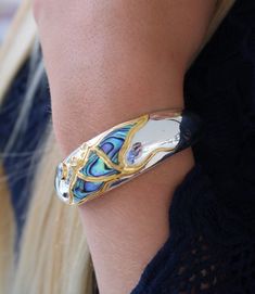 Manta Ray Cuff Bracelet. Sterling Silver, 18K Gold Vermeil Plated, Blue Topaz Please contact me before ordering this piece, might be out of stock. 7 inch Slightly adjustable International customers please keep in mind that you might need to pay customs fee upon receiving item depending on your country regulations. To better understand the size of item please look thru images, each of listings contains item next to a dime coin, which is 0.7 inch in diameter. Pieces with Abalone (Paua) Shells have Adjustable Blue Cuff Bracelet For Anniversary, Elegant Blue Oyster Bracelet, Elegant Blue Cuff Bracelet With Polished Finish, Blue Cuff Bracelet Gift, Blue Cuff Bracelet Bangle For Formal Occasions, Blue Bangle Cuff Bracelet For Formal Occasions, Formal Blue Bangle Cuff Bracelet, Oyster Cuff Bracelet As Gift, Polished Cuff Bangle As Gift