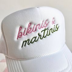 Bikinis & Martinis Embroidered Trucker Hat 100% polyester Foam trucker hat with mesh back, adjustable snap closure and embroidered design. Adjustable Trucker Snapback Hat For Summer, White Trucker Hat For Beach Season, Adjustable Flat Brim Trucker Hat For Summer, Adjustable Trucker Hat With Embroidered Logo And Flat Brim, Adjustable Trucker Hat With Embroidered Logo And Visor, Summer Mesh Hats One Size Fits Most, Summer Mesh Hat One Size, Adjustable Mesh Summer Hat, Beach Mesh Snapback Hat