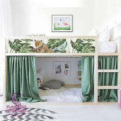 there is a bunk bed with curtains on the top and bottom, next to an animal themed wallpaper