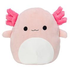 a pink stuffed animal with wings on it's head and eyes, sitting against a white background