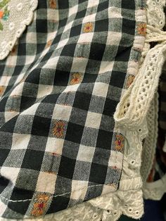 an old black and white checkered shirt with lace