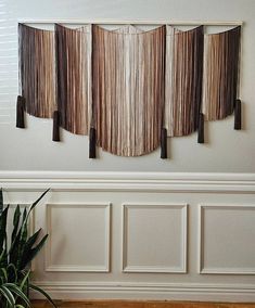 the wall hangings are made out of wood strips