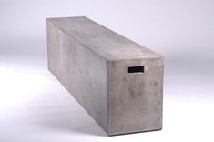 a concrete box sitting on top of a white floor