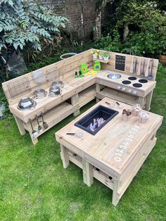 an outdoor kitchen made out of pallet wood