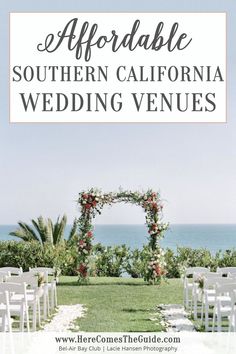 an outdoor wedding venue with white chairs and flowers on the aisle, overlooking the ocean