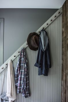 coat rack with hats and coats hanging on it