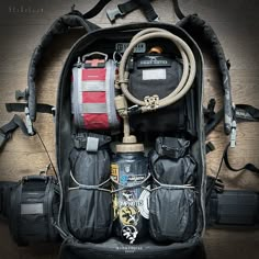 the contents of a backpack are neatly packed and ready to be loaded with supplies for hiking