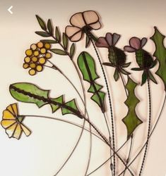 a group of glass flowers and leaves on a white background with the words, flower power