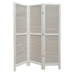 a white room divider with shutters on the top and bottom panel, open