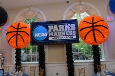 an indoor event with balloons and basketballs