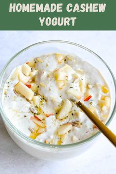 homemade cashew yogurt in a glass bowl with a spoon