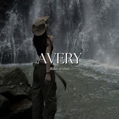 a woman standing in front of a waterfall with the words avery written on it