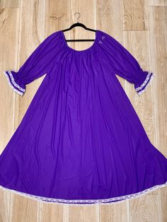 Here we have a lovely Lucie Ann purple nightgown with white ruffled lace trim. Made up of soft and stretchy nylon. Rich jeweltone purple color - Color is closest to the picture of the model wearing the gown. Measurements: Bust - 40 inches Length shoulder to hem - 50 inches Size is Petite, however this could fit a variety of different sizes - Model shown is 6 feet tall and wears a size 6/8 dress and 34DD bust and far from petite and this fit just beautifully! This gown is in very good condition w Fitted Ruffle Nightgown For Bedtime, Purple Lace Sleepwear With Lace Trim, Fitted Ruffled Nightgown For Sleep, Stretch Lace Trim Dress For Loungewear, Stretch Dresses With Lace Trim For Loungewear, Purple Lace Trim Nightgown For Sleep, Purple Lace Trim Nightgown, Purple Lace Trim Nightgown For Bedtime, Stretch Lace Trim Sleepwear For Bedtime