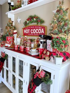 a christmas display with hot cocoa and other holiday decorations