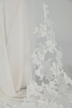 a veil with white flowers on it