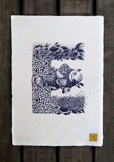 a blue and white print with fish on it