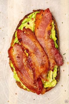 two bacon and avocado toasts on a plate