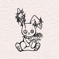 a black and white drawing of a rabbit holding a flower