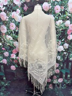 Vintage 1970's triangle shawl is made from cream fine netted lace. It has a woven floral pattern with large flowers throughout. The bottom has a 5 inch long fringe. Shawl measures 67 inches across the top and over 48 inches long.  Good condition with no holes. Please see photos for more details. All items are vintage that are preowned. All of the items may show some form of wear due to their age. Please kindly remember that these items are anywhere from 30-80 years old. I make every attempt to clearly describe the item, including any flaws or wear to the best of my ability. Returns are not accepted based on the condition of the item. I urge you to the please contact me with any and all questions. I am happy to provide more photos of the item on request. Traditional Lace Shawl With Lace Trim, Vintage White Shawl Scarf, Summer Lace Shawl, One Size Lace Shawl, Bohemian Lace Shawl For Spring, Cream Bohemian Shawl For Spring, Bohemian Lace Shawl With Lace Work, Bohemian Cream Lace Shawl, Bohemian Lace Shawl In Cream