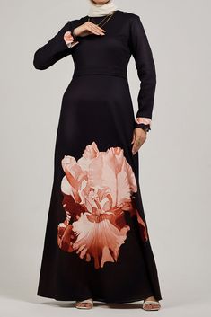 Elevate your wardrobe with our elegant crepe polyester maxi dress, adorned with a delicate ditsy floral print. This sophisticated piece features a high neck and gracefully flared sleeves, offering a refined and modest look. The standout feature is the layered peplum detail at the waist, adding a touch of flair and femininity. The dress is unlined, providing a lightweight and breathable option perfect for warm weather. Embrace the exquisite design and make a stylish statement with this beautifull Elegant High Neck Maxi Dress For Spring, Modest Black Maxi Dress For Formal Occasions, Modest Maxi Dress For Evening, Modest Evening Maxi Dress, Feminine Floral Print Maxi Dress For Evening, Fitted Modest Maxi Dress With Modesty Panel, Formal Floral Print Floor-length Maxi Dress, Fall Evening Maxi Dress With Floral Print, Elegant Long Sleeve Maxi Dress With Modesty Panel