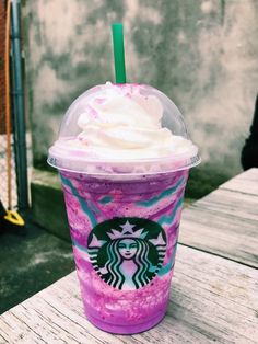 a pink drink with whipped cream on top