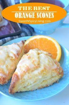 orange scones on a blue plate with an orange slice