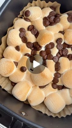 a pie with chocolate chips and marshmallows in it