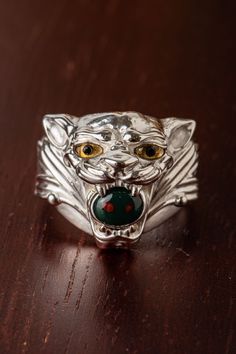 The Sterling Jaguar clenching bloodstone in its jaws. The eyes are made from micro-sculpted citrine and black tourmaline. Black Tourmaline, Jaguar, Gold Pendant, Citrine, Tourmaline, Cuff Bracelets