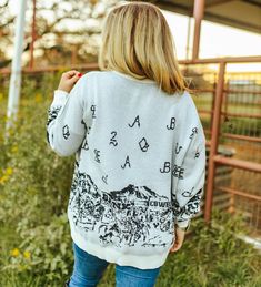 Our Sparkle Town Sweater is the perfect cozy Christmas fit 🎄 Go grab one of these for a loved one, making the perfect gift! #western #cowgirl #nfr #rodeo