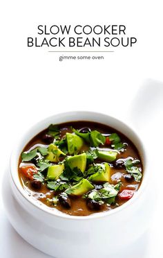 a white bowl filled with black bean soup