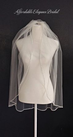 a mannequin with a veil on top of it