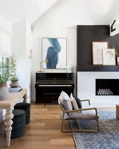 a living room filled with furniture and a piano