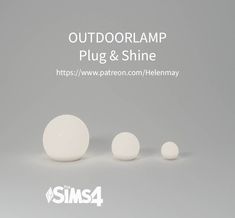 three white balls sitting next to each other in front of a gray background with the words outdoorlamp plug & shine