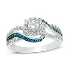 a white gold ring with blue and white diamonds