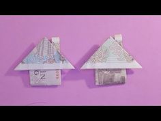 two origami houses made out of money