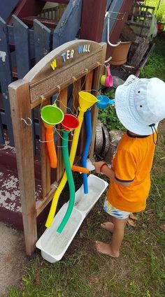 a little boy that is playing with some toys