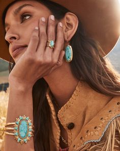 Let your accessorizing do the talking when you style the Havana Vintage Gold Cuff Bracelet in Variegated Turquoise Magnesite. The boldest bracelet in the West, this cuff features hammered metal, textured adornments, and a statement-sized stone center. This bracelet is a part of Yellow Rose by Kendra Scott—a brand that celebrates ranch life with Kendra Scott staples alongside select curated jewelry pieces and accessories. Metal Vintage 23k Yellow Gold Over Brass Material Variegated Turquoise Magn