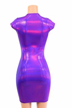 "This item is made to order, please read all the way through the listing before purchasing! This dress is made of a grape purple holographic spandex, with AMAZING shine! The deep purple reflects liquid fuchsia rainbows all over your curves, accentuating every move you make! It features a scoop neckline and cap sleeves. It is made of four way stretch lycra spandex, and it fits like a glove! Super figure flaunting and fun! LENGTH: 27\" (from the underarm to the hemline) Womens Sizing (See below fo Fitted Purple Mini Dress With Short Sleeves, Purple Fitted Bodycon Dress With Short Sleeves, Purple Fitted Short Sleeve Bodycon Dress, Purple Short Sleeve Bodycon Party Dress, Purple Short Sleeve Bodycon Dress For Party, Purple Bodycon Dress For Club, Fitted Rave Party Dresses, Shiny Sleeveless Fitted Bodycon Dress, Purple Fitted Bodycon Dress For Club