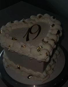 a white cake with the number nine on it