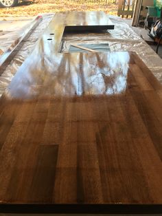 a wooden table is being prepared to be polished