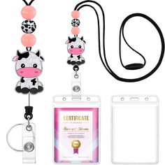 an id badge and lanyard attached to a cell phone with a cow on it