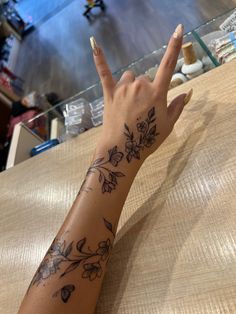 Tattoo + nails = perfect combination❤️ Tattoos With Deep Meaning For Black Women, Cute Outline Tattoos For Women, Hand Tattoos Wrap Around, Tiger Lily Vine Tattoo, Arm Sleeve With Small Tattoos, Personalized Tattoos Ideas, Floral Wrap Around Tattoo Forearm Color, Hibiscus Flower Back Tattoos, Unique Flower Tattoos For Women