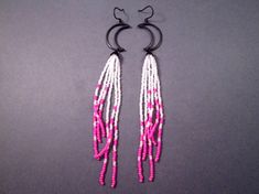 Six strands of hot pink and white glass seed beads, with gunmetal black flower bead caps, dangle from 24x18mm gunmetal crescent moon connectors, and french hook ear wires. Long - These earrings measure five and 1/2 inches in length See more of my designs here; justEARRINGS.etsy.com Same style, different colors here: https://www.etsy.com/shop/justEARRINGS?ref=seller-platform-mcnav&search_query=shoulder+moon And please visit my sister~shops; justCHARMING.etsy.com & BohoDreamJewelry.etsy.com All of Sewing Jewelry, Beaded Jewelry Earrings, Beaded Earrings Native, Seed Bead Patterns, Long Dangle Earrings, Black Flower, Silver Moon